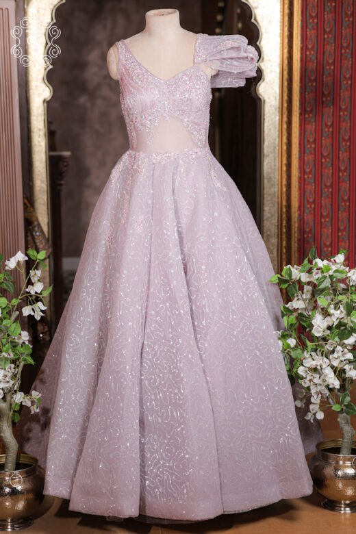 Detailed view of the abstract glitter trails and floral waist sprigs on the skirt of the Embellished Sweetheart Corset Ball Gown.
