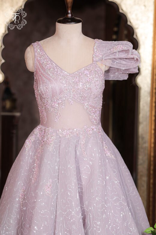Close-up of the floral beadwork, sequin gridwork, and sheer midriff panel on the corset bodice of the Embellished Sweetheart Corset Ball Gown.
