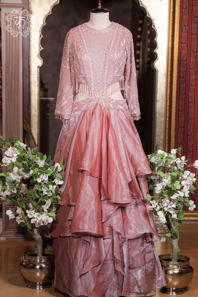 Close-up of the side waist cut-out with dangling glass bead fringe drops on the Cut-Out Waist Hand-Embroidered Organza Tiered Ruffle Gown.