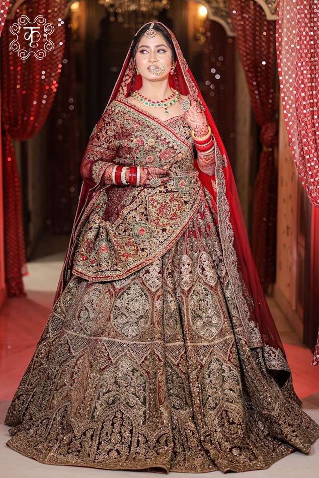 Complete floor-length bridal silhouette of the Heavy Zardozi Hand-Embroidered Bridal Velvet Lehenga Set from Kridhaa.