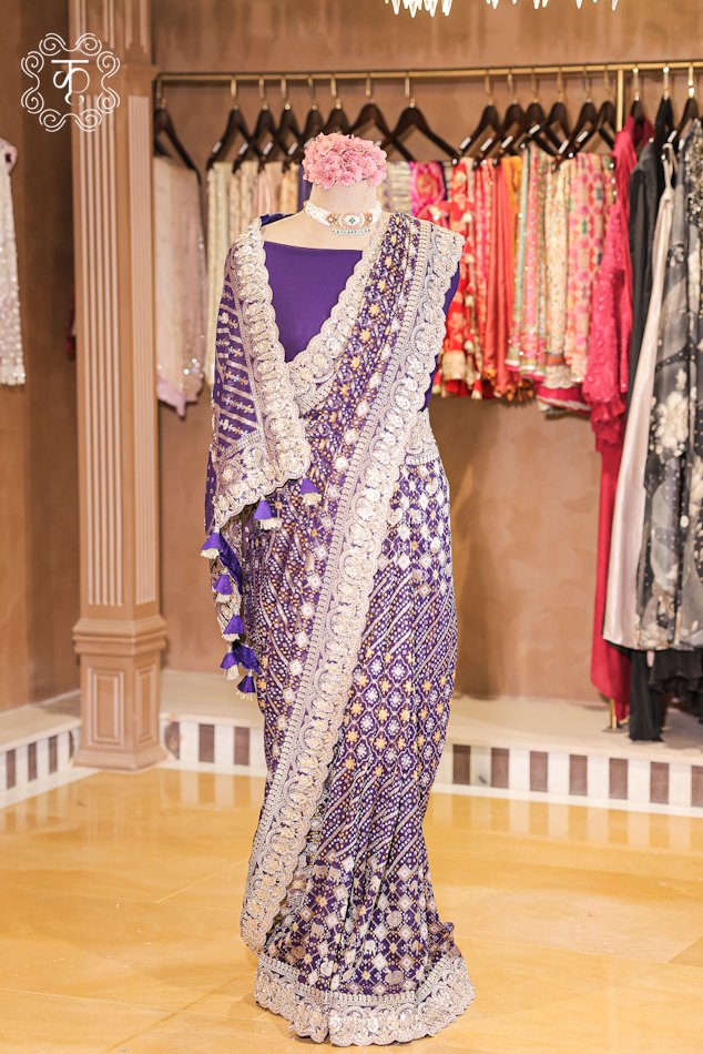 Close-up of the silver zardozi, sequins, and pearl accents on the scalloped border of the Bandhani Georgette Saree.