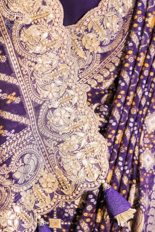 Detailed view of the solid silk-blend blouse fabric paired with the Bandhani Georgette Saree.