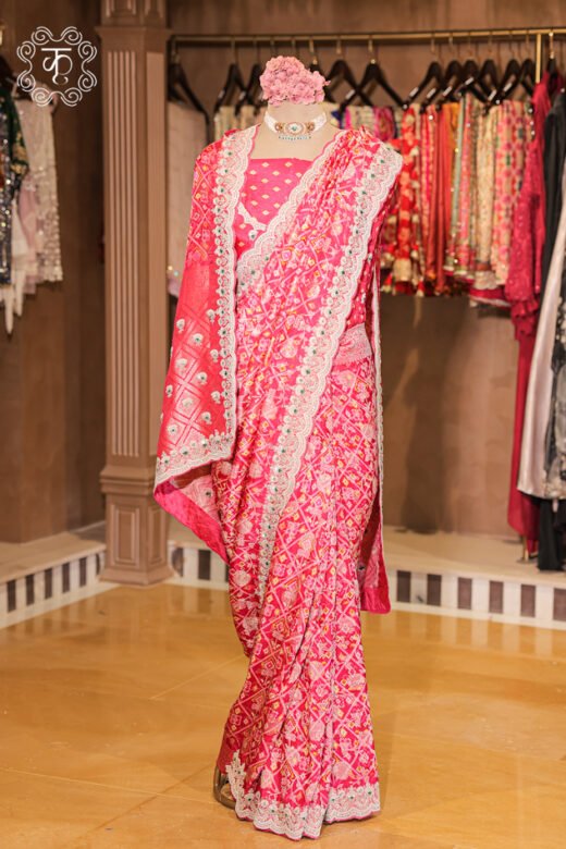 Close-up of the traditional bandhani print and woven zari pallu of the Bandhani Print Silk Saree.