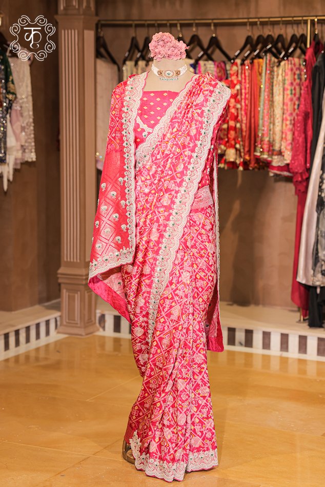 Close-up of the traditional bandhani print and woven zari pallu of the Bandhani Print Silk Saree.
