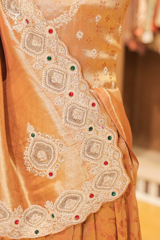 Close-up of the metallic tissue silk luster and woven floral jaal patterns on the Banarasi Tissue Silk Floral Brocade Saree.