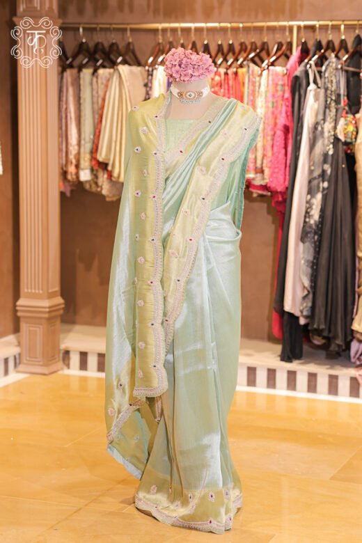 Dual-Tone Metallic Tissue Silk Saree featuring an iridescent tissue body, floral bootis, and a hand-embroidered scalloped zardozi border from Kridhaa.