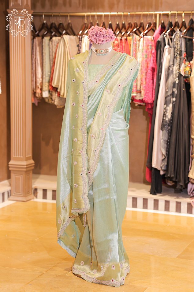 Dual-Tone Metallic Tissue Silk Saree featuring an iridescent tissue body, floral bootis, and a hand-embroidered scalloped zardozi border from Kridhaa.