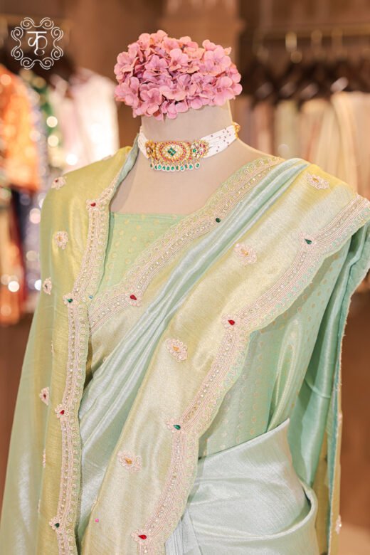 Close-up of the dual-tone metallic tissue silk weave and floral sequin bootis on the Dual-Tone Metallic Tissue Silk Saree.