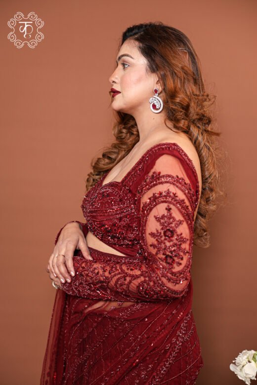 Close-up of the intricate cutdana and sequin illusion embroidery on the sheer net sleeves of the Georgette Concept Pre-Draped Saree.