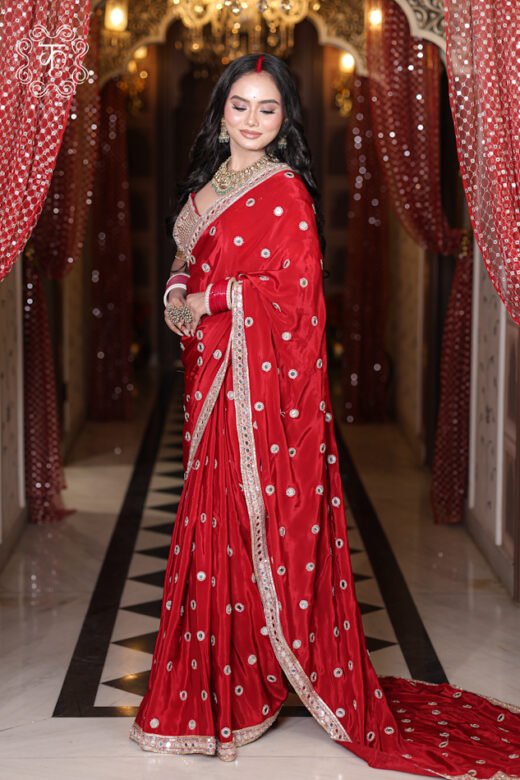 Silk Satin Saree with Mirror Work featuring circular mirror bootis, heavily embroidered zardozi border, and a bridal blouse from Kridhaa.