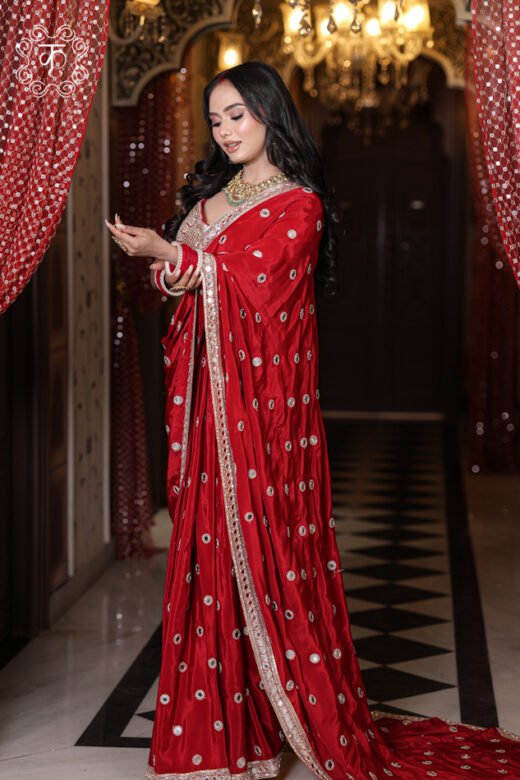 Close-up of the smooth silk satin luster and scattered mirror bootis on the Silk Satin Saree with Mirror Work.