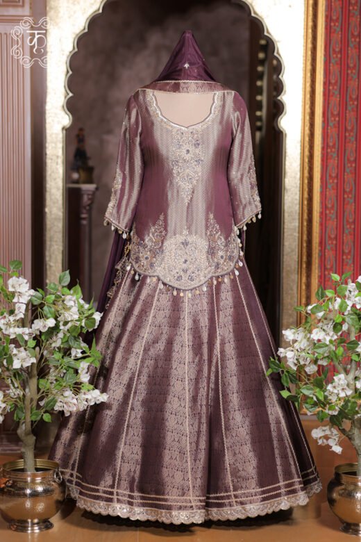 Banarasi Silk Brocade Lehenga Set featuring a short kurta with hand-embroidered zardozi neckline, shell tassels, flared lehenga skirt, and silk dupatta from Kridhaa.