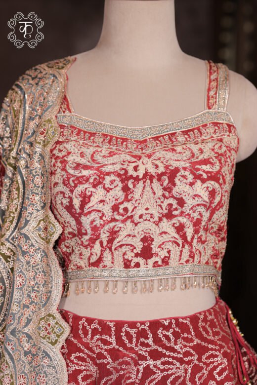 Detailed view of the printed artwork and heavily embroidered border on the dupatta of the Printed Silk Lehenga Set.