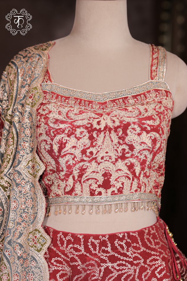 Detailed view of the printed artwork and heavily embroidered border on the dupatta of the Printed Silk Lehenga Set.