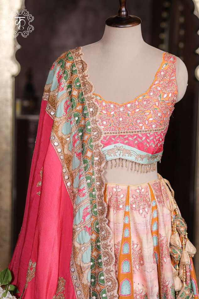 Close-up of the architectural panel prints, elephant motifs, and heavy tassel latkans on the Printed Silk Lehenga Set skirt.