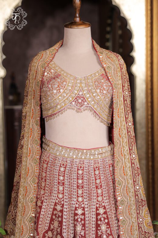 Detailed view of the scalloped mirror-work borders and zardozi embroidery on the cape dupatta of the Embroidered Georgette Lehenga Set.