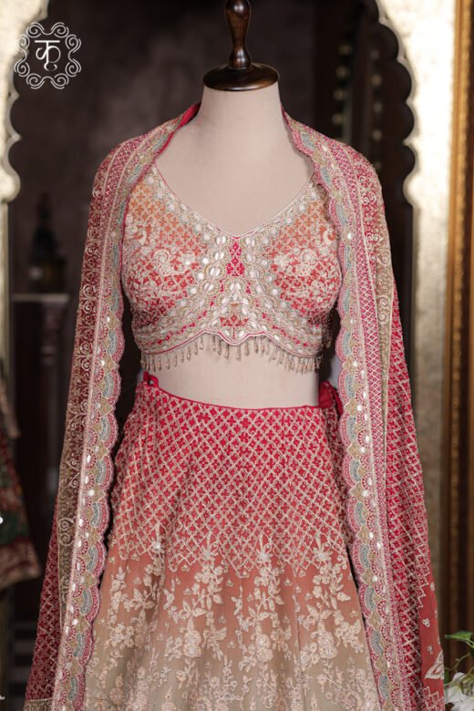 Close-up of the chikankari lattice, jharokha architectural panels, and peacock motifs on the skirt of the Ombre Georgette Lehenga Set.