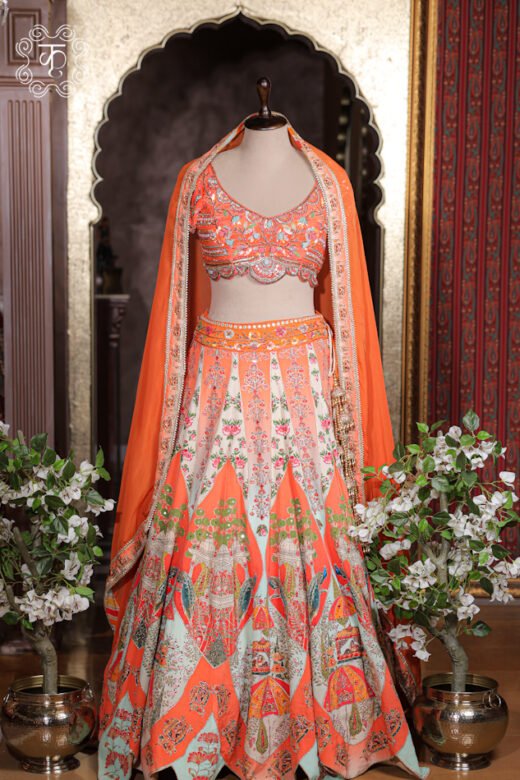 Detailed view of the embroidered border and lightweight sheer drape of the cape dupatta on the Printed Silk Lehenga Set.