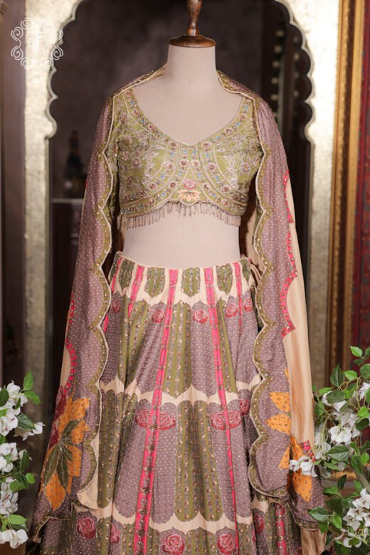 Close-up of the V-neck, multi-color thread embroidery, sequin highlights, and fringed hem tassels on the choli of the Printed Silk Lehenga Set.