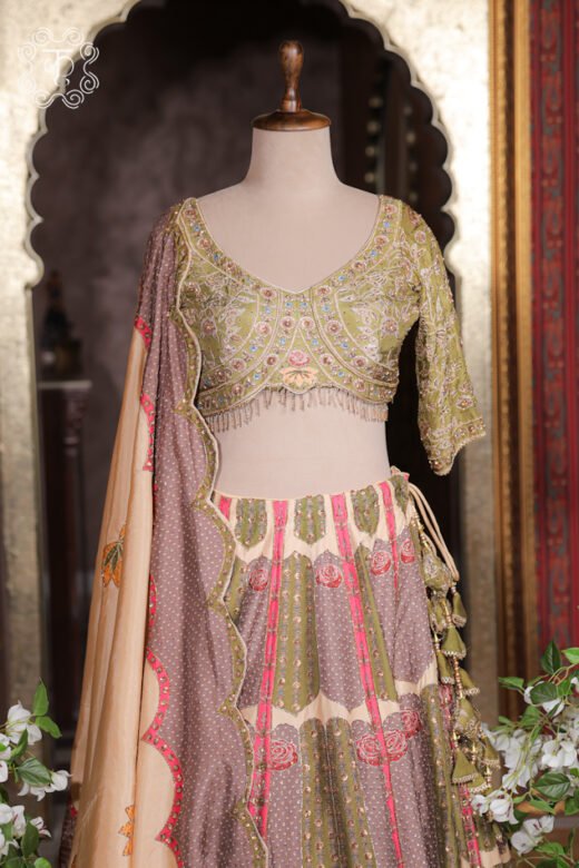 Close-up of the V-neck, multi-color thread embroidery, sequin highlights, and fringed hem tassels on the choli of the Printed Silk Lehenga Set.