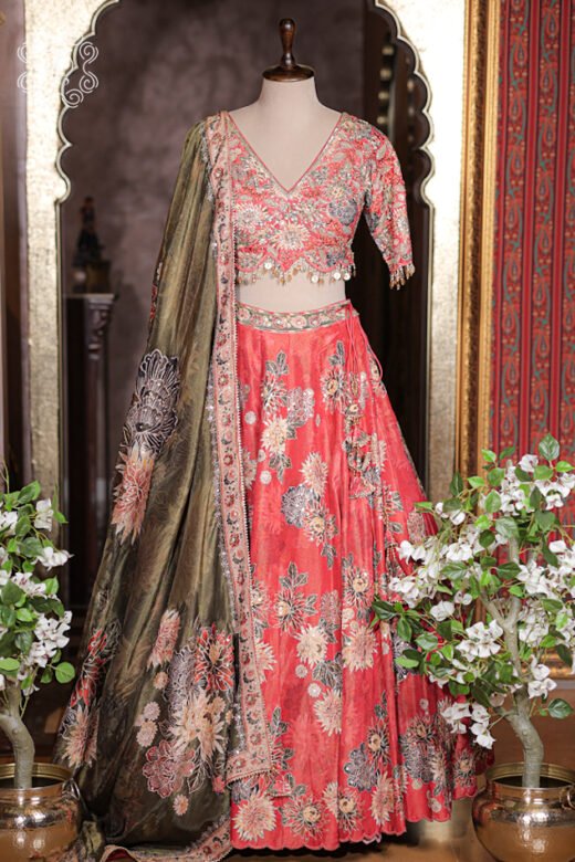Olive green silk dupatta with rich floral embroidered border matching coral red lehenga.