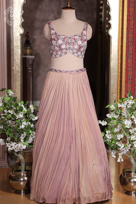 Close up of crushed georgette pleats showing subtle ombre dusty rose pink tones.