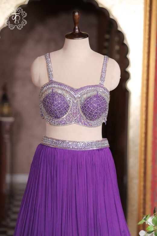 Royal purple crush pleated georgette lehenga set with silver mirror embroidered bustier blouse.