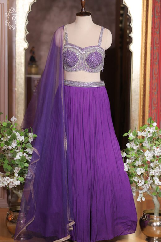 Texture detail of royal purple micro crush georgette pleats showing soft luster and movement.
