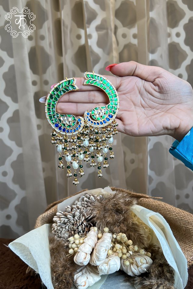 Gold and green stone pendant with dangling bead drops, held in hand — Kridhaa Kashmiri Jewellery collection
