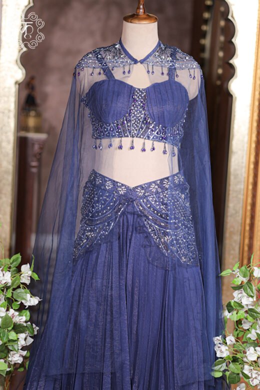 Heavily embroidered waist yoke of navy blue lehenga skirt with silver sequins and crystal work.