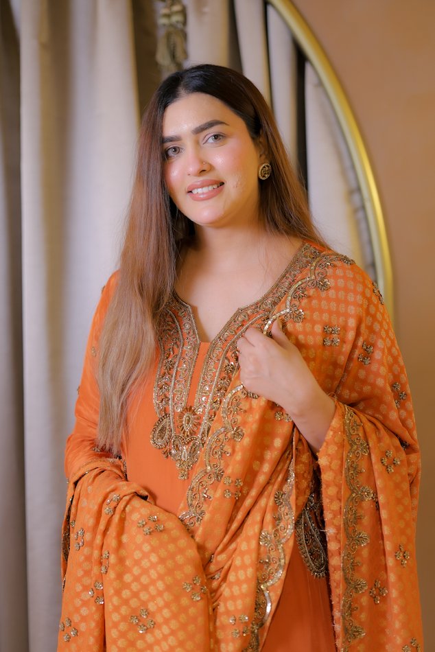 Orange festive embroidered suit set with detailed neckline and dupatta