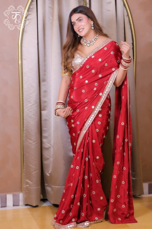 Red embroidered designer saree with gold motifs and border
