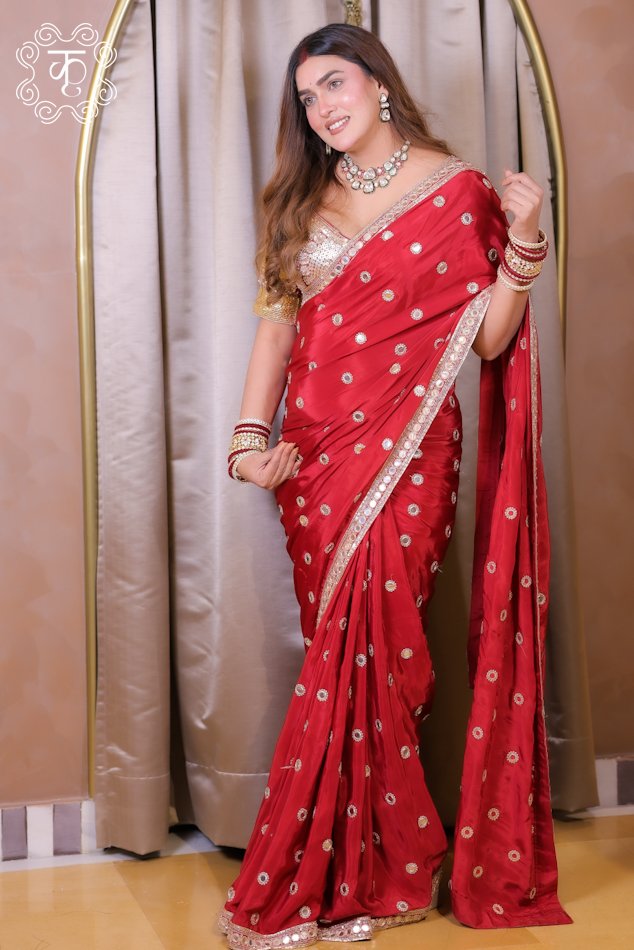 Red embroidered designer saree with gold motifs and border
